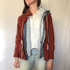 Rust coat and sweat shirt